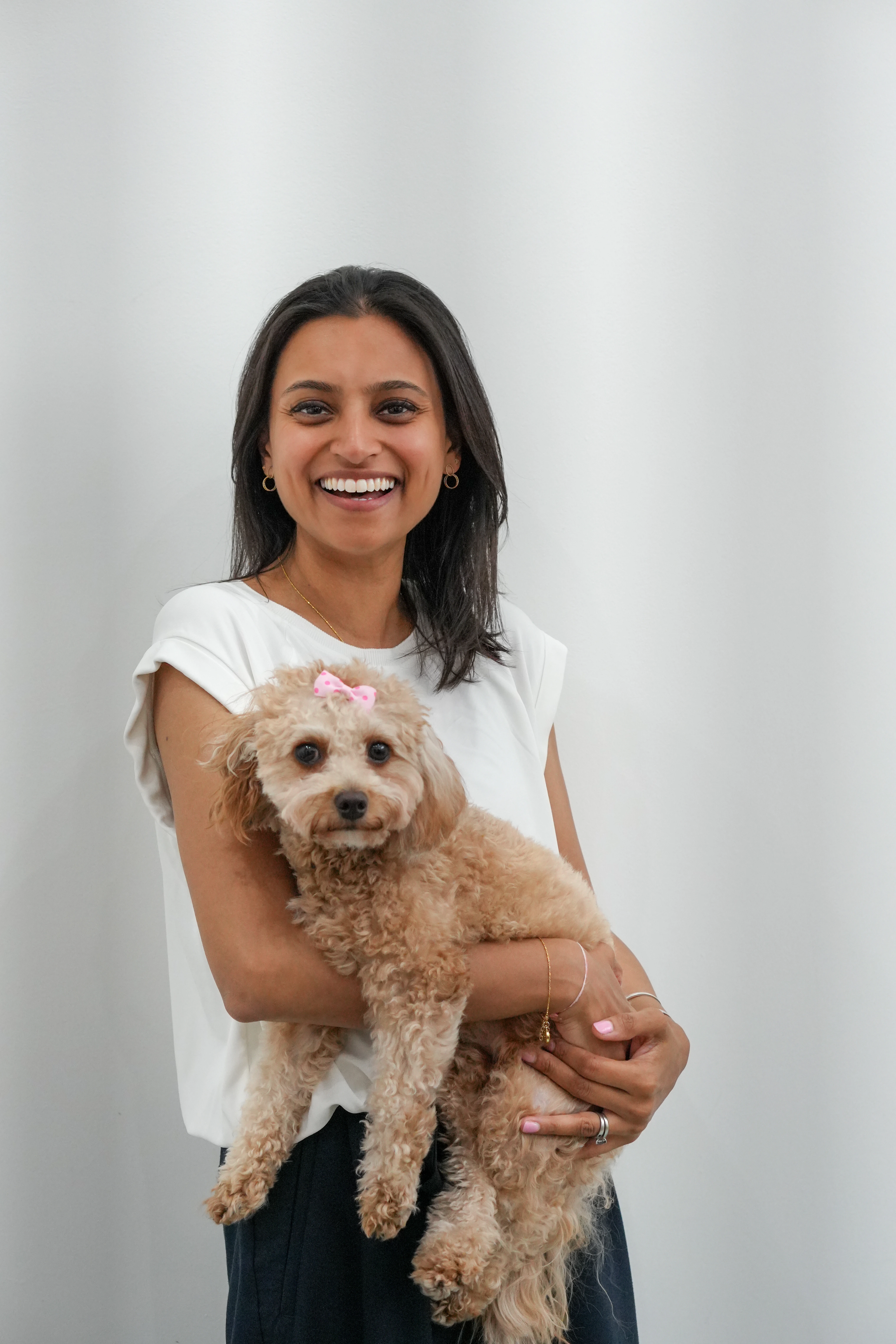 Elderly man with long gray beard and glasses smoking an orange pipe